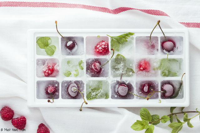 Homemade fruit infused water. Make your own fruit ice cubes to add to your water plus a recipe to add a kick to your water. Helps increase daily water intake!