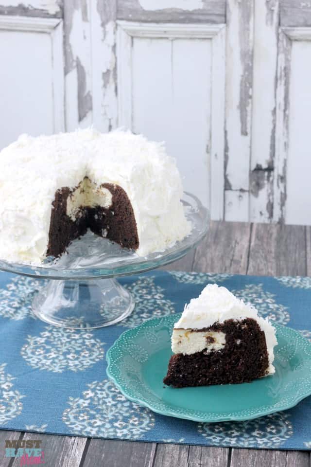 Easy Snowball Cake Recipe with a delicious cream cheese center and a Cool Whip Coconut Frosting! Easy one bowl dessert!