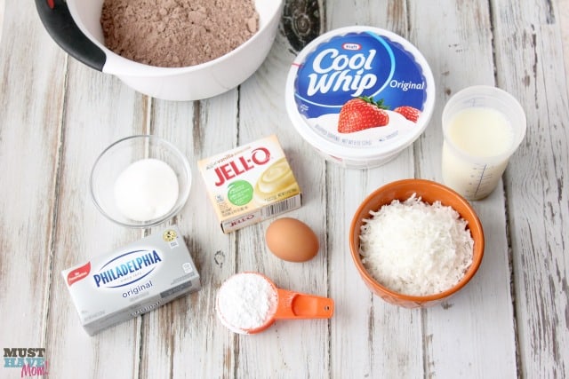 Easy Snowball Cake Recipe with a delicious cream cheese center and a Cool Whip Coconut Frosting! Easy one bowl dessert!