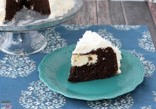 Easy Snowball Cake Recipe with a delicious cream cheese center and a Cool Whip Coconut Frosting! Easy one bowl dessert!