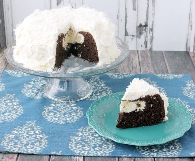 Easy Snowball Cake Recipe with a delicious cream cheese center and a Cool Whip Coconut Frosting! Easy one bowl dessert!