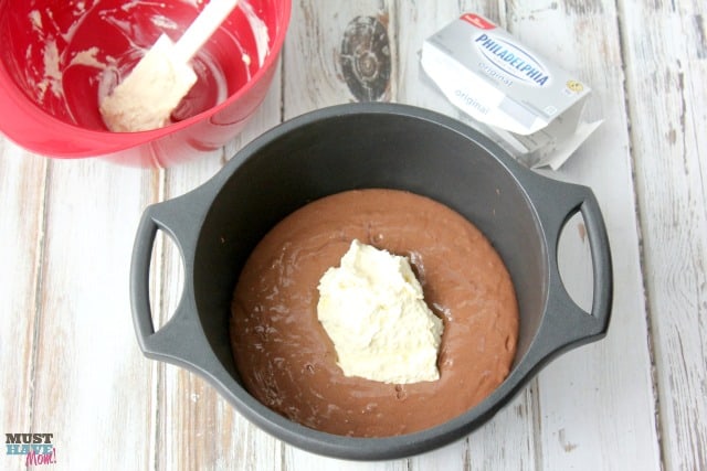 Easy Snowball Cake Recipe with a delicious cream cheese center and a Cool Whip Coconut Frosting! Easy one bowl dessert!