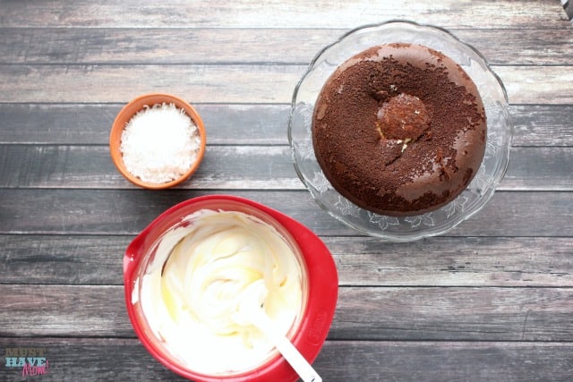 Easy Snowball Cake Recipe with a delicious cream cheese center and a Cool Whip Coconut Frosting! Easy one bowl dessert!