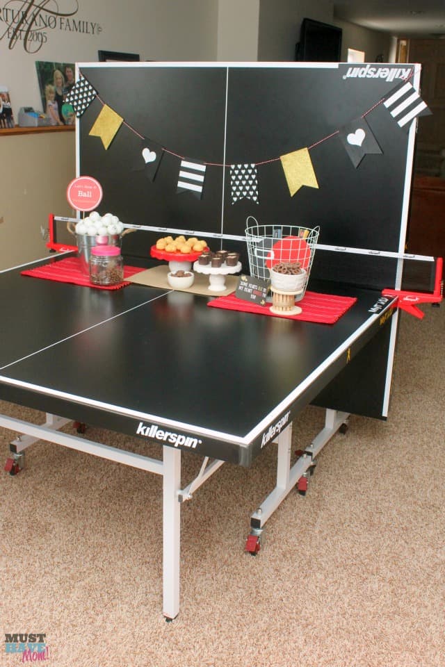 Valentine's Day Date Night In Idea with free printables! Have a fun ping pong date night at home. Free ping pong ball printables to create your themed date night. No sitter on Valentine's Day doesn't mean you can't have a fun date night at home!