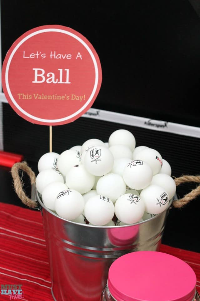 Valentine's Day Date Night In Idea with free printables! Have a fun ping pong date night at home. Free ping pong ball printables to create your themed date night. No sitter on Valentine's Day doesn't mean you can't have a fun date night at home!