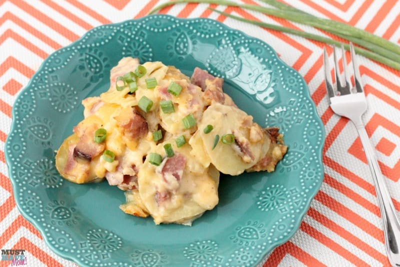 Cheesy Scalloped Potatoes and Ham Recipe that is great for using up leftover ham! This is the BEST cheesy potatoes and ham recipe too. So delicious!