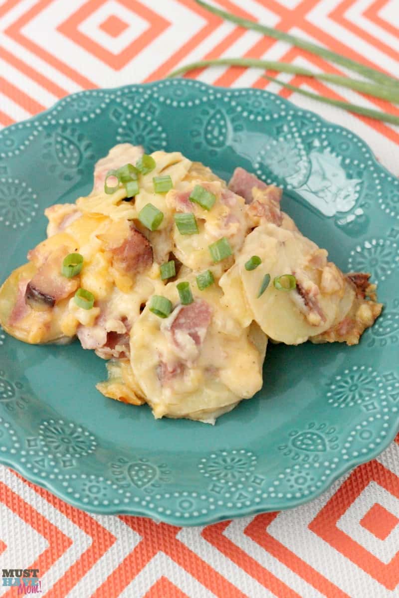 Cheesy Scalloped Potatoes and Ham Recipe that is great for using up leftover ham! This is the BEST cheesy potatoes and ham recipe too. So delicious! 