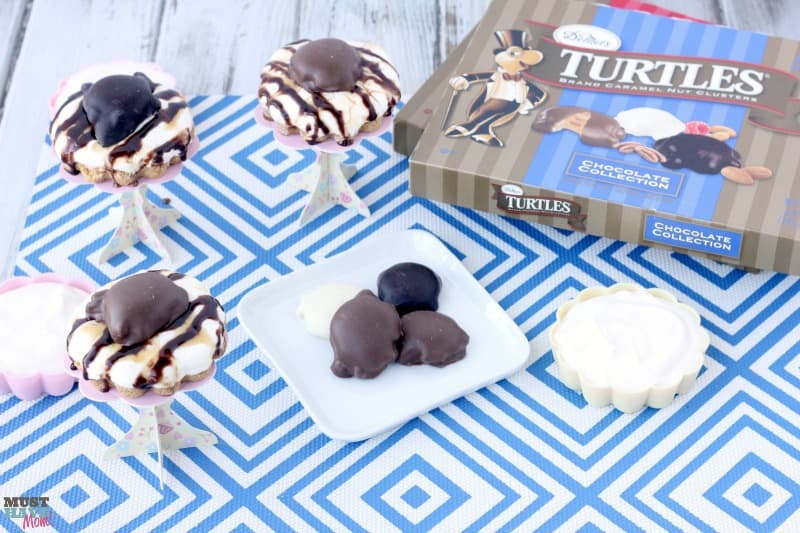 Chocolate and Caramel TURTLES® easy mini cheesecakes recipe! These no bake mini cheesecakes are the perfect easy dessert idea! Quick easy dessert that looks fancy!