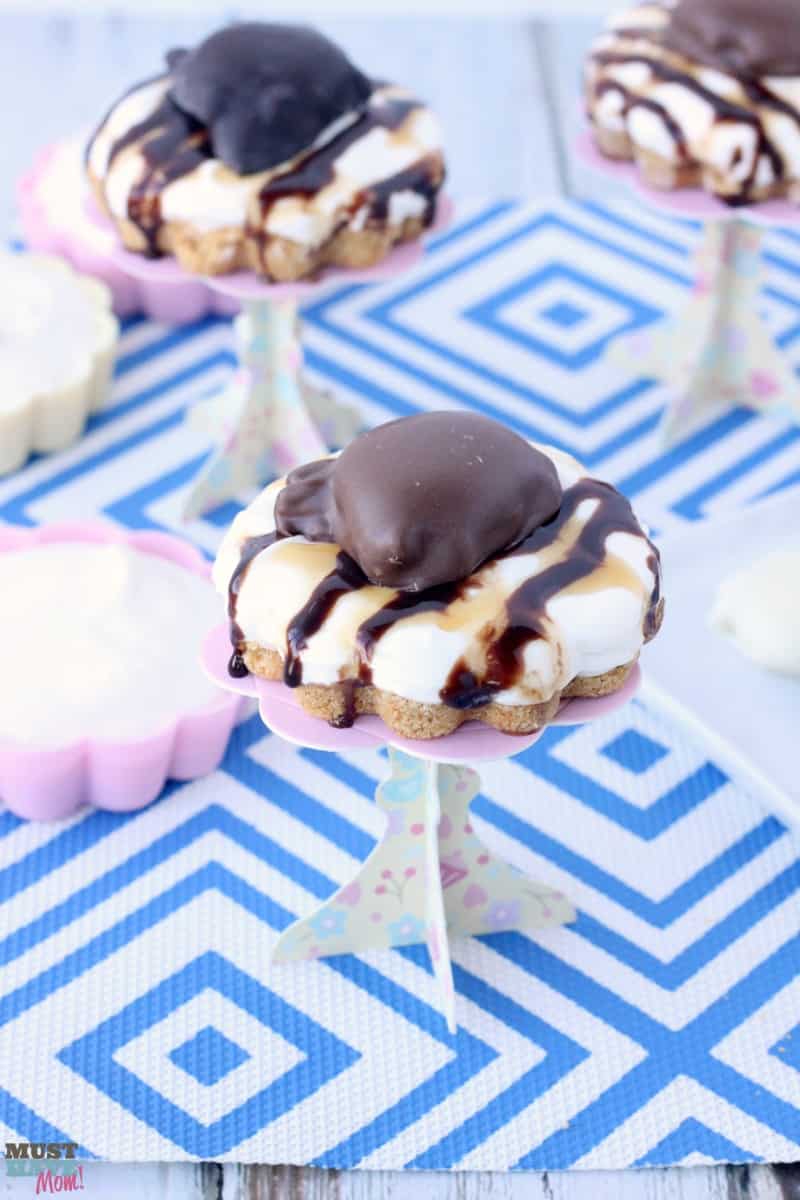 Chocolate and Caramel TURTLES® easy mini cheesecakes recipe! These no bake mini cheesecakes are the perfect easy dessert idea! Quick easy dessert that looks fancy!