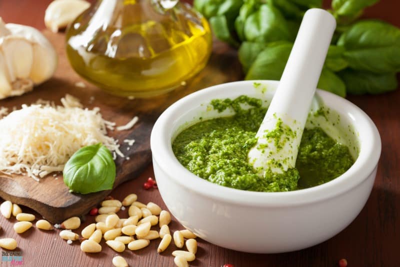 The best basil pesto recipe ever! Easy to make pesto using garden fresh basil, parmesan and garlic! So yummy! Use on pasta, spaghetti squash, bread, pizza and more!