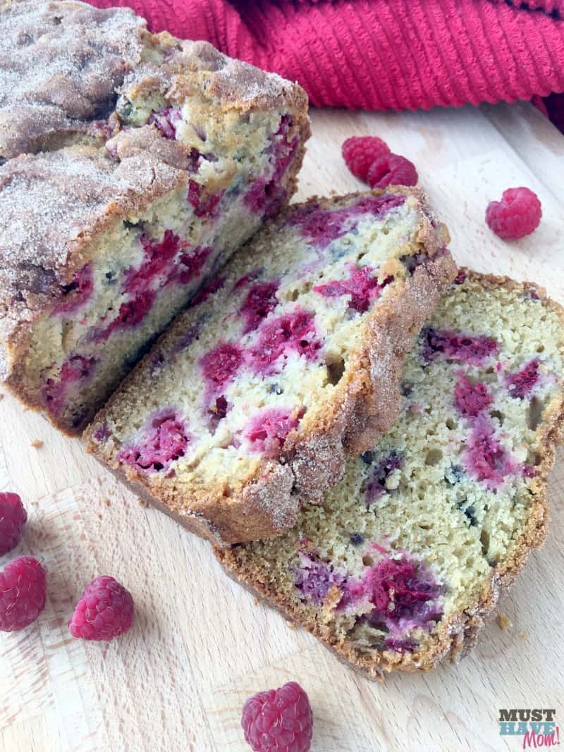 The best summer raspberry bread ever! Moist, mouth-watering berries nestled in a cinnamon sugar topped quick bread.