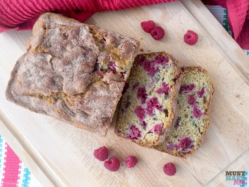 The best summer raspberry bread ever! Moist, mouth-watering berries nestled in a cinnamon sugar topped quick bread. 