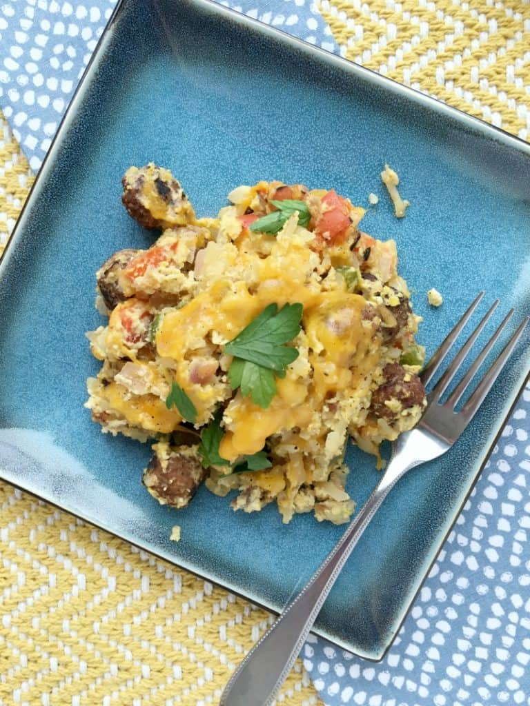Easy one skillet sausage and egg breakfast hash recipe. Quick and easy breakfast with hashbrowns, eggs, sausage meatballs, veggies combined in a one pot meal! Hearty breakfast and can make it over a campfire too!