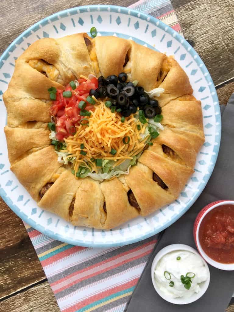 Easy Meatball Taco Ring Recipe! Great weeknight recipe idea or party food idea! Could be served as an appetizer or a meal. Crowd pleasing recipe! Easy recipe to whip together and have done in 30 minutes or less!