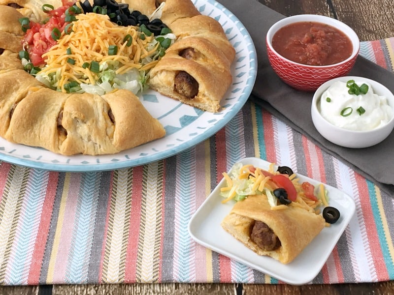 Easy Meatball Taco Ring Recipe! Great weeknight recipe idea or party food idea! Could be served as an appetizer or a meal. Crowd pleasing recipe! Easy recipe to whip together and have done in 30 minutes or less!