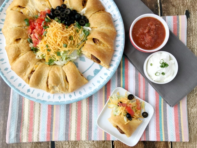 Easy Meatball Taco Ring Recipe! Great weeknight recipe idea or party food idea! Could be served as an appetizer or a meal. Crowd pleasing recipe! Easy recipe to whip together and have done in 30 minutes or less!