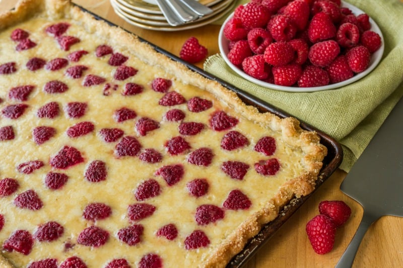 Raspberry Buttermilk Slab Pie Recipe. Perfect raspberry recipe to use up those summer berries! Dessert recipe that can serve a crowd!