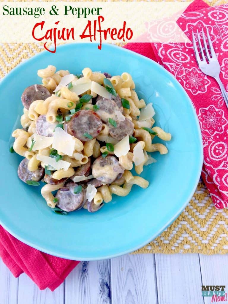 20 Minute Sausage and Pepper Cajun Alfredo recipe! Make this 2 ingredient alfredo sauce with sausage, peppers and onions for a quick weeknight meal idea! 