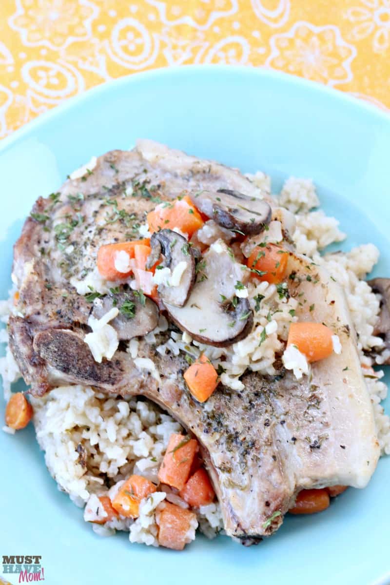 Instant Pot ranch pork chops with rice, carrots and mushrooms all cooked at the same time! Great one pot meal. Cook pork chops and rice together in the instant pot!