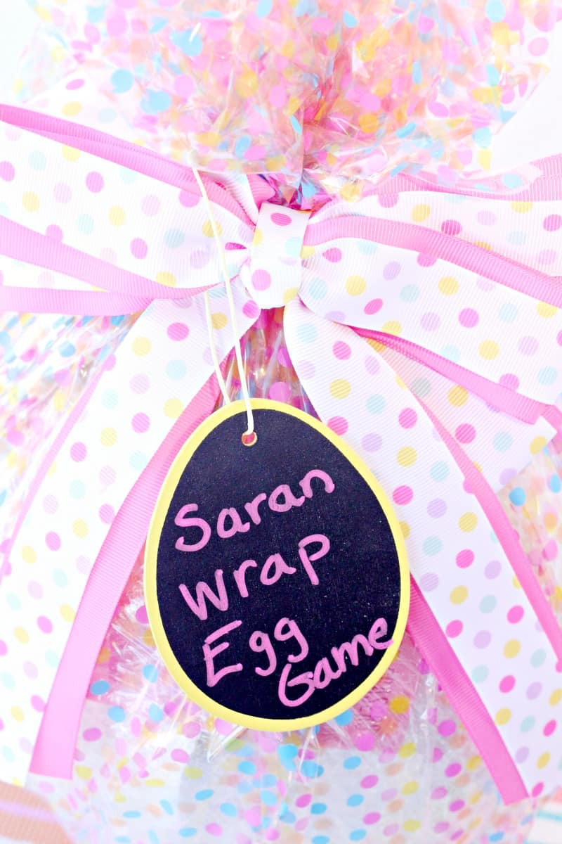 Easter egg saran wrap game idea! Start a new Easter tradition with this spin on the popular saran wrap ball game!