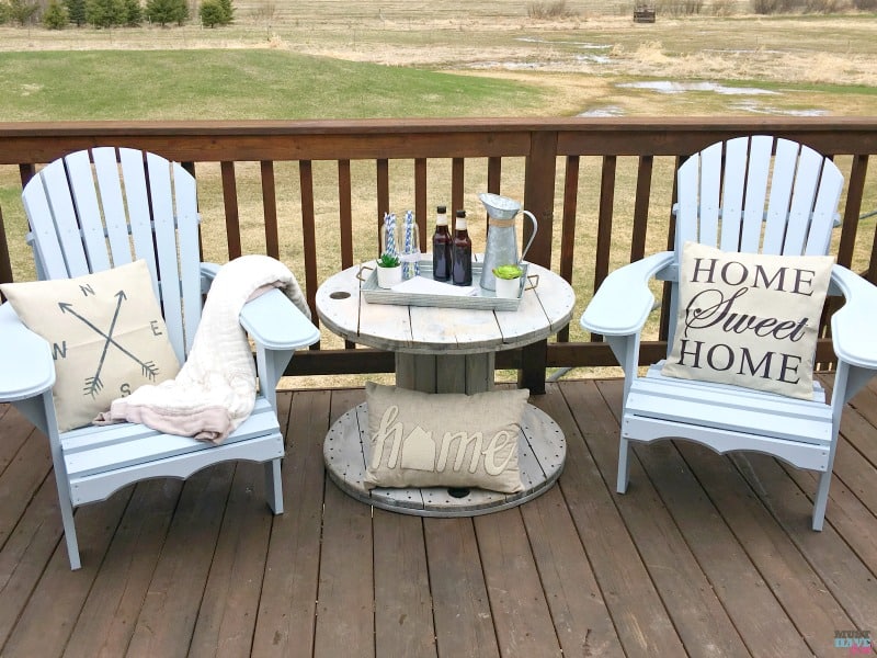 How to DIY farmhouse style adirondack chairs. Build them, paint them and style them! She shows you how. Bring farmhouse decor outdoors!