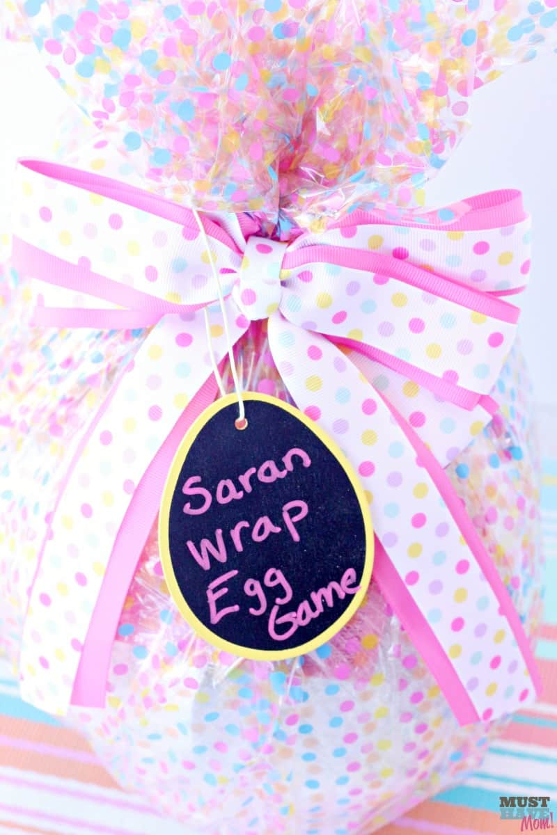 Easter egg saran wrap game idea! Start a new Easter tradition with this spin on the popular saran wrap ball game!