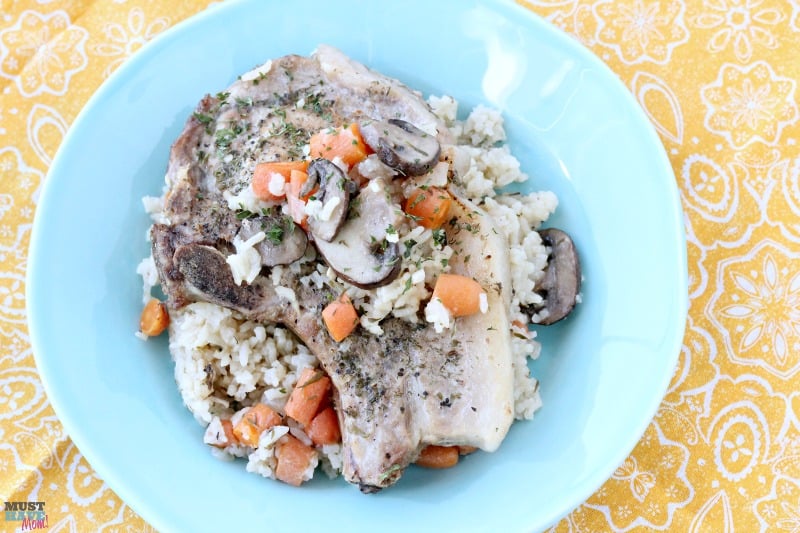 Instant Pot pork chops with rice, carrots and mushrooms all cooked at the same time! Great one pot meal. Cook pork chops and rice together in the instant pot!