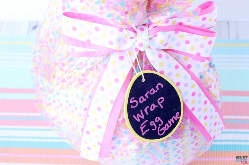 Easter egg saran wrap game idea! Start a new Easter tradition with this spin on the popular saran wrap ball game!