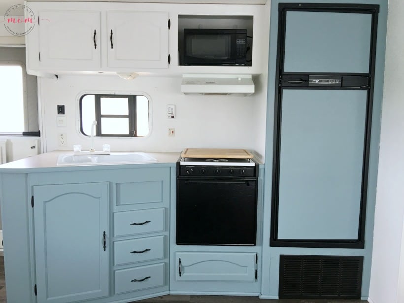 https://musthavemom.com/wp-content/uploads/2017/05/How-to-paint-an-rv-kitchen-cabinets-with-beyond-paint-nantucket-and-white.jpg