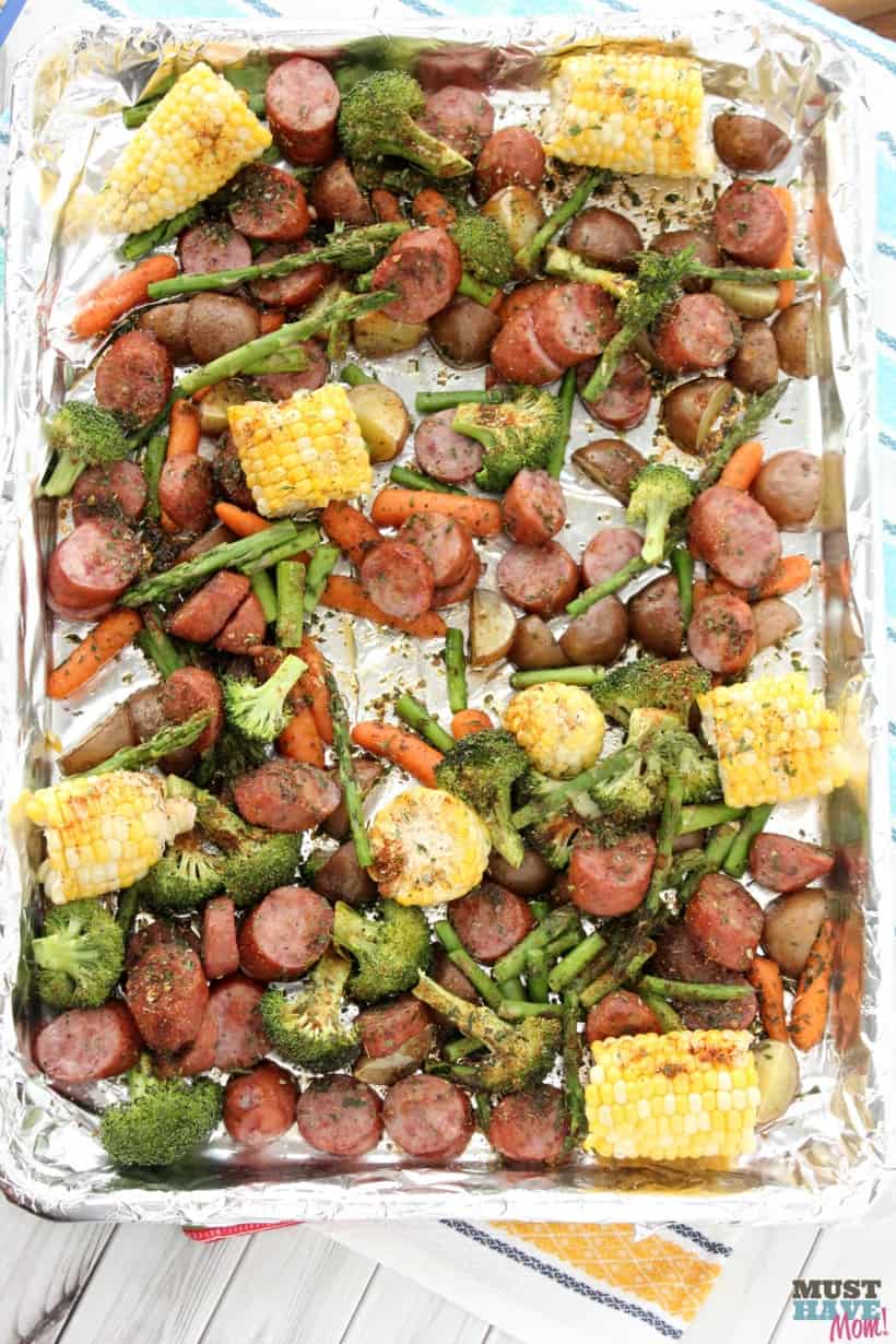 Sheet pan dinners make for easy cleanup and quick meals! This Sausage & Veggie sheet pan supper recipe is bursting with flavor and is AMAZING! One pan meal for busy nights!