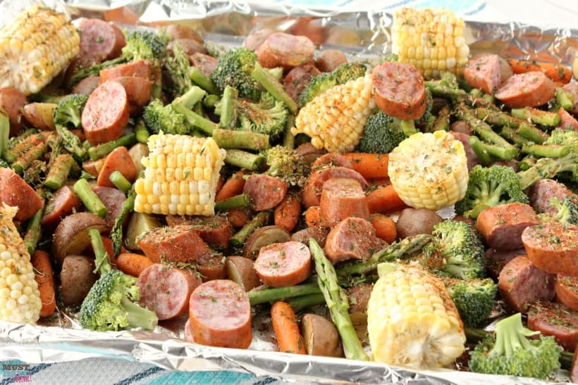 Sheet pan dinners make for easy cleanup and quick meals! This Sausage & Veggie sheet pan supper recipe is bursting with flavor and is AMAZING! One pan meal for busy nights!