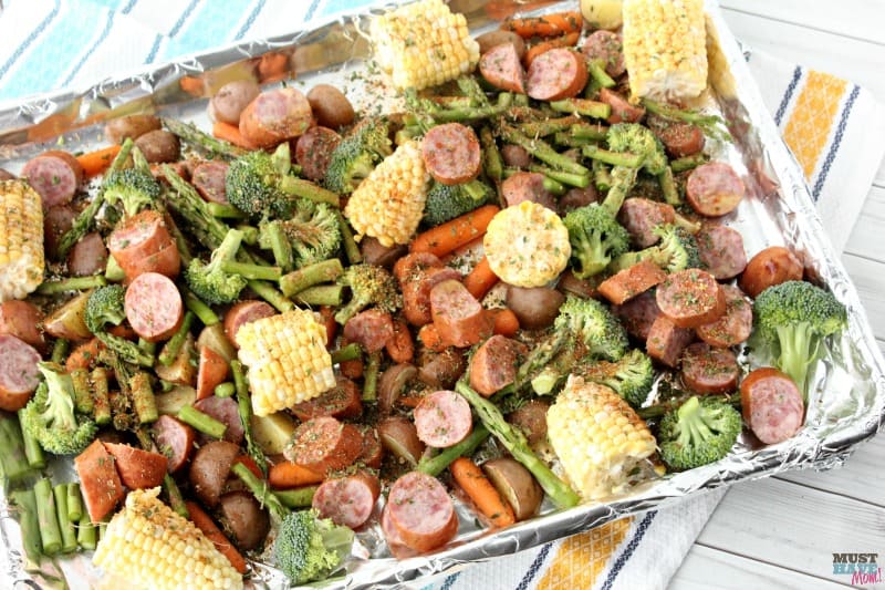 Sheet pan dinners make for easy cleanup and quick meals! This Sausage & Veggie sheet pan supper recipe is bursting with flavor and is AMAZING! One pan meal for busy nights!