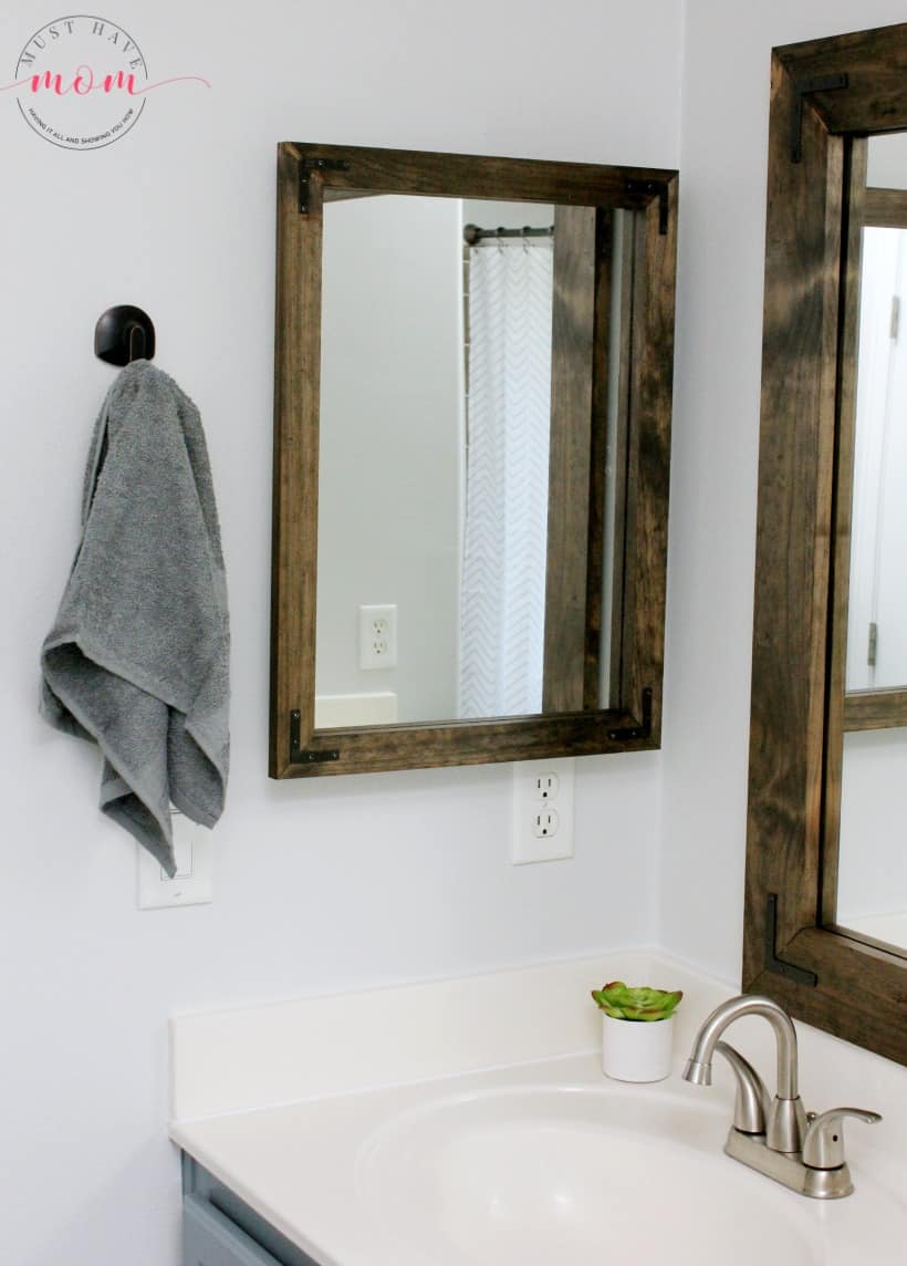 Farmhouse bathroom medicine cabinet makeover DIY. Take your look up a level with this idea!