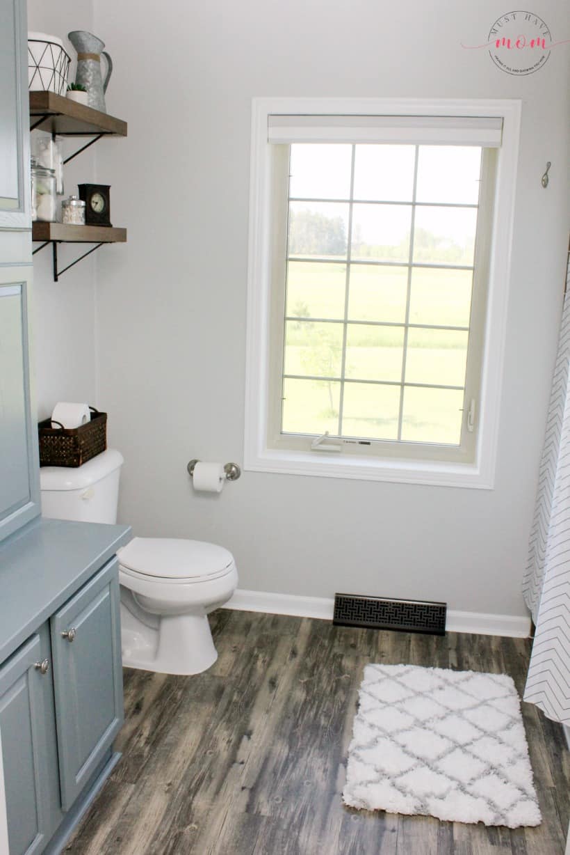 DIY farmhouse style bathroom. Use layering to achieve a fixer upper style bathroom.