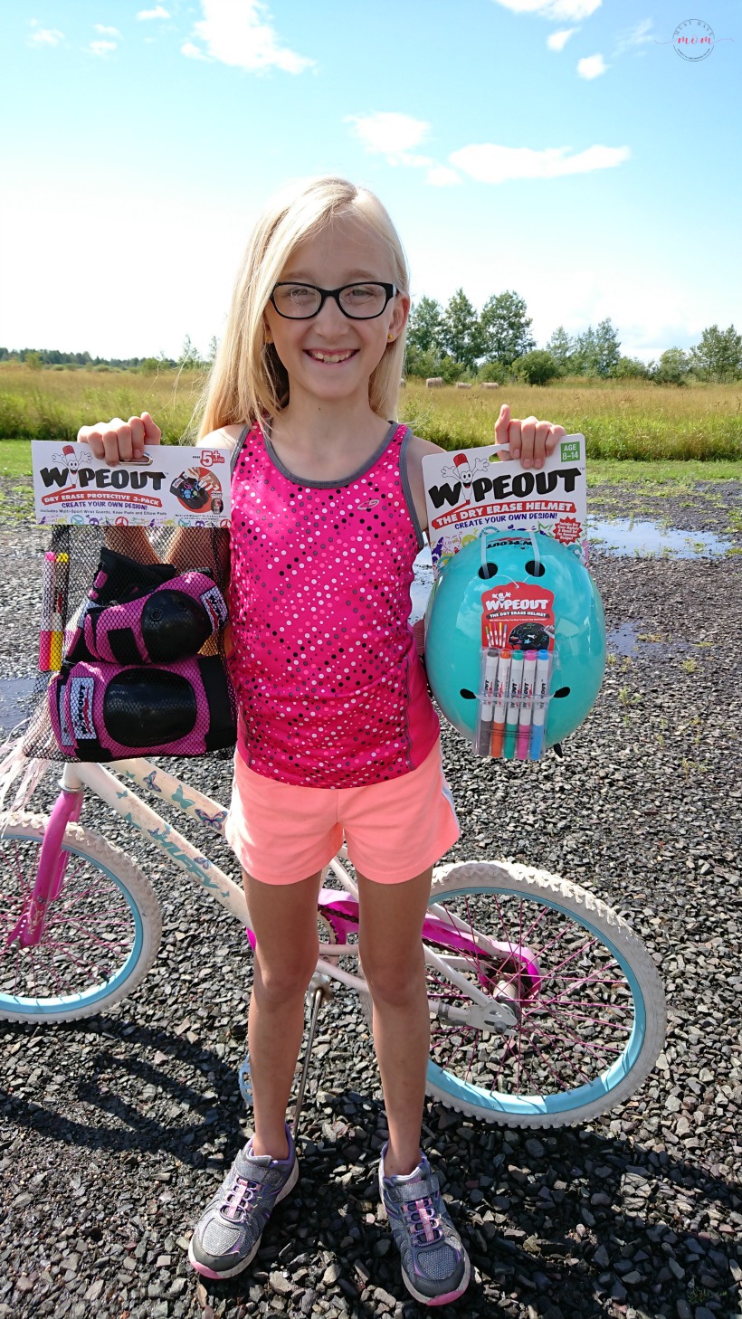 Teach your kids bike safety through play! Fun activity to decorate bike helmet, free printable bicycle license and cone course!