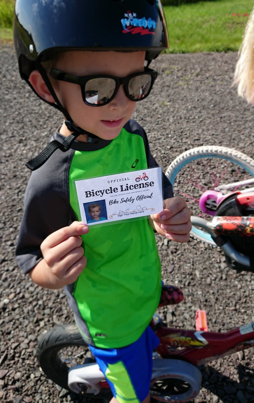 Teach your kids bike safety through play! Fun activity to decorate bike helmet, free printable bicycle license and cone course!