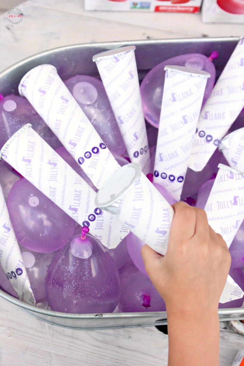 Do THIS genius ice bucket party hack at your next party! Use frozen water balloons to keep sorbet pops frozen and then have a water balloon fight afterwards! 
