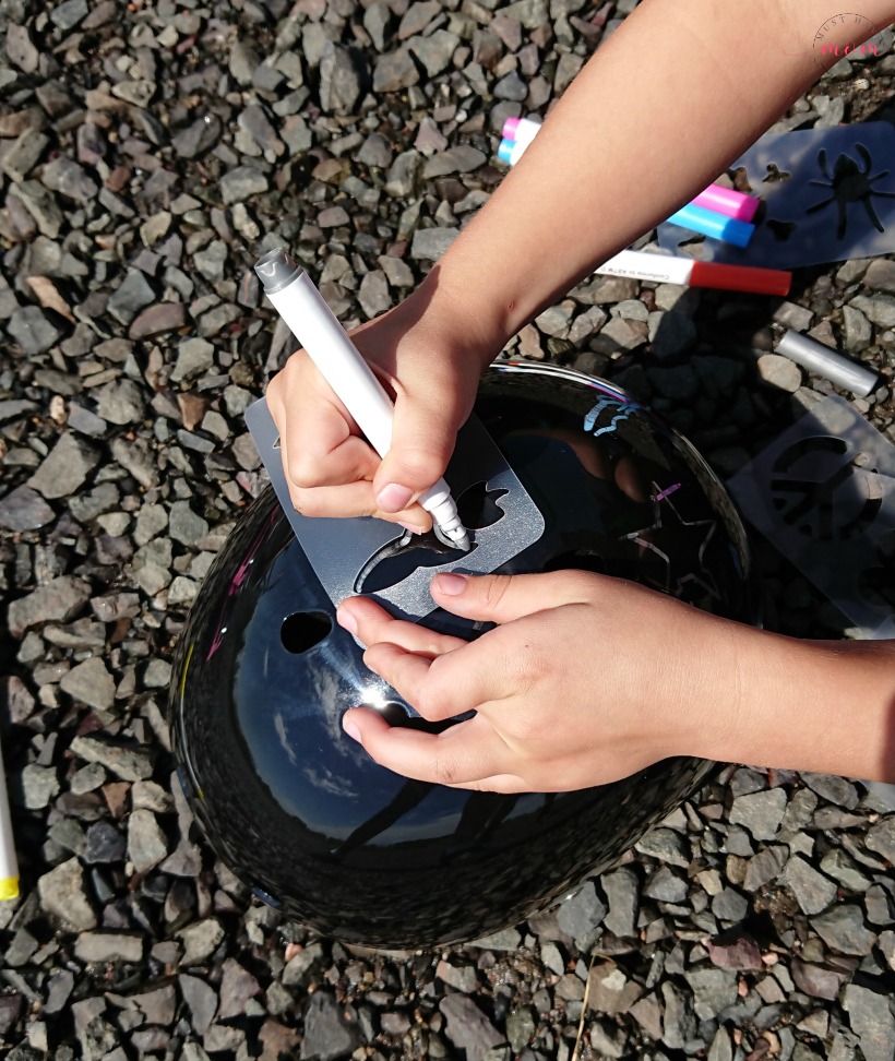 Teach your kids bike safety through play! Fun activity to decorate bike helmet, free printable bicycle license and cone course!