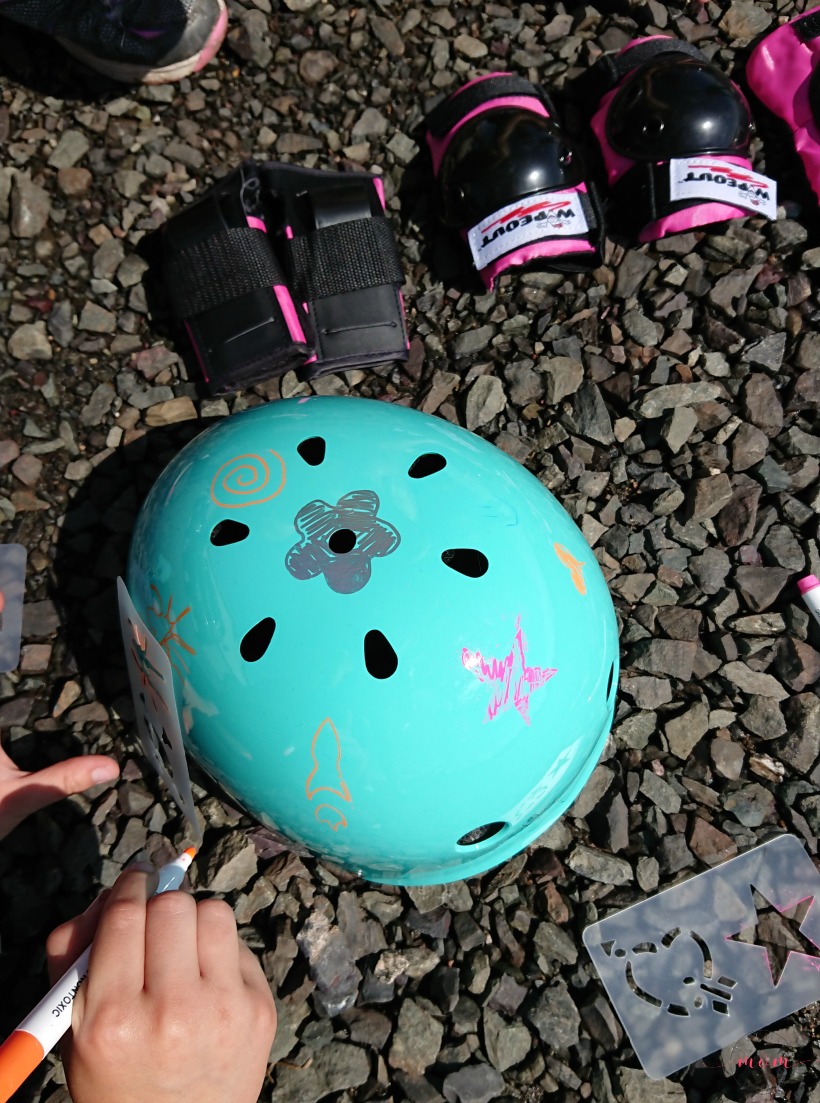 Teach your kids bike safety through play! Fun activity to decorate bike helmet, free printable bicycle license and cone course!