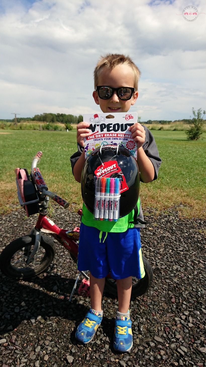 Teach your kids bike safety through play! Fun activity to decorate bike helmet, free printable bicycle license and cone course!