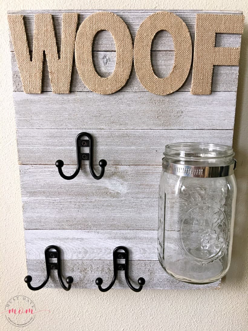 DIY Dog sign with treat jar and dog leash holder! Make this fun dog treat jar pet sign that is functional and adorable!