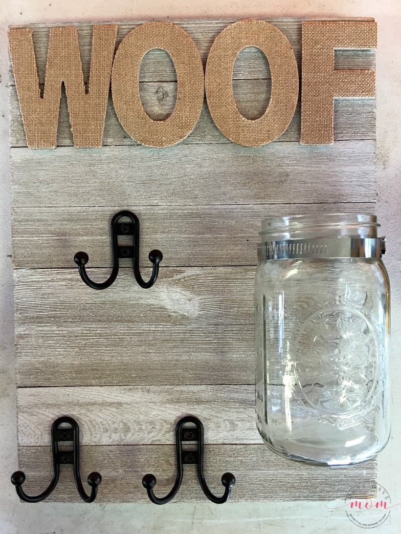 DIY Dog sign with treat jar and dog leash holder! Make this fun dog treat jar pet sign that is functional and adorable!