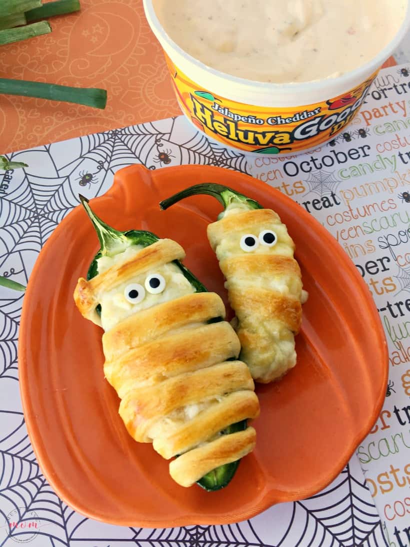 Halloween food idea! Mummy jalapeno poppers in oven. Baked jalapeno poppers are easy and this recipe uses healthier ingredients.