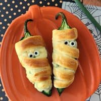 Halloween food idea! Mummy jalapeno poppers in oven. Baked jalapeno poppers are easy and this recipe uses healthier ingredients.