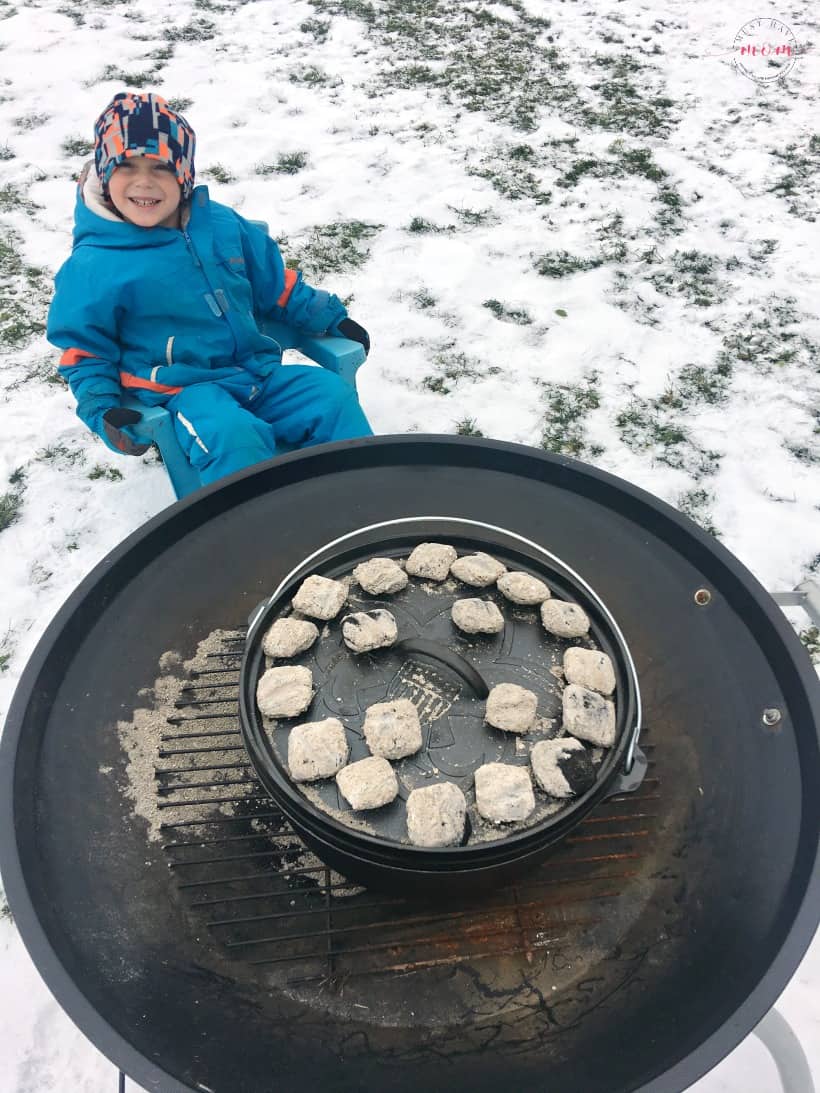 dutch oven with coals on lid