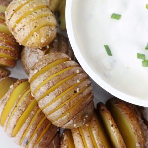Mini hasselback potatoes recipe with bacon horseradish dip. Great party food idea or side dish + it's quick and easy.