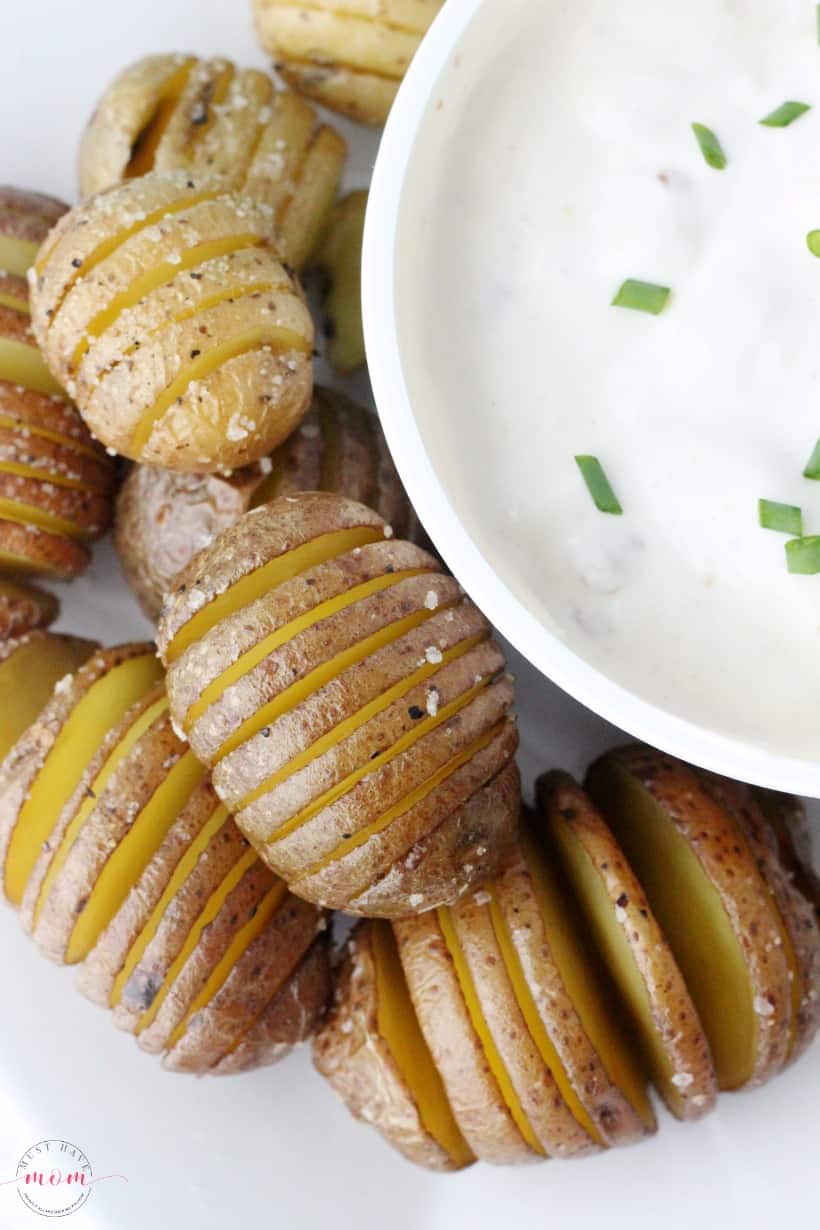 Mini hasselback potatoes recipe with bacon horseradish dip. Great party food idea or side dish + it's quick and easy.