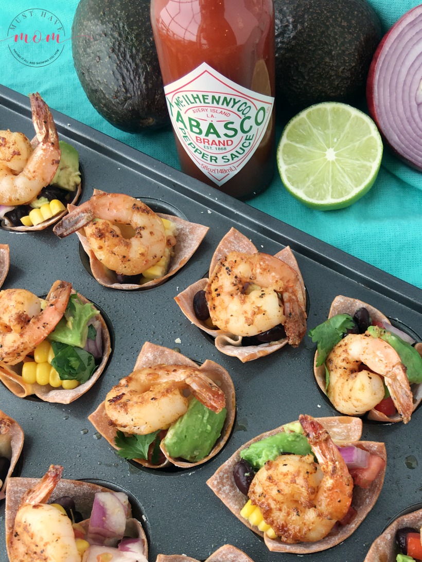 Spicy shrimp wonton cups with black bean corn avocado guacamole. Great party appetizer for the big game!