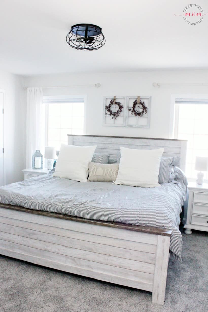 farmhouse bedroom with hypoallergenic carpet. Great fixer upper bedrooms style and colors.