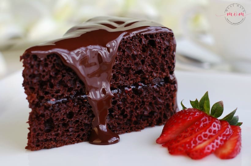 Paleo chocolate cake recipe! Layered chocolate cake topped with strawberries. With superfood addition that my kids love!